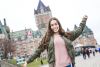 Student posing cheerfully outside her Canadian university campus